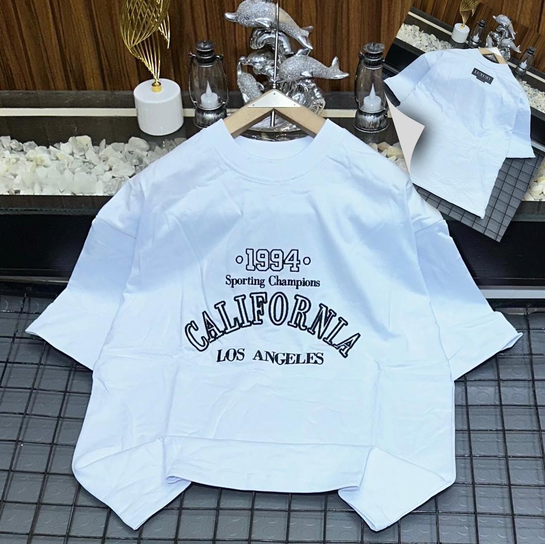 White oversized t-shirt with 1994 California Los Angeles graphic print.