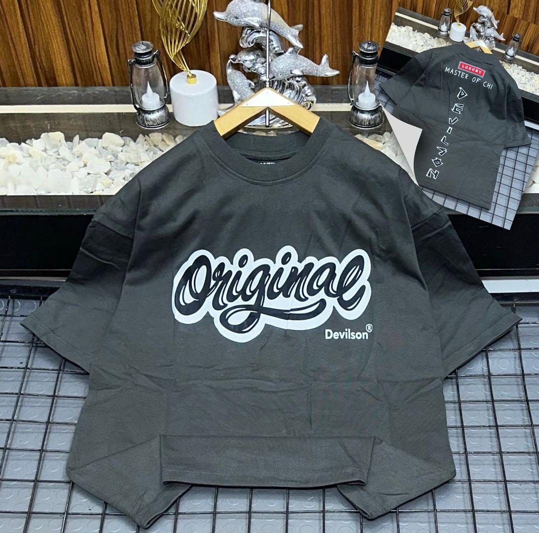 Dark olive oversized polo with Original Devilson cursive graphic on front.