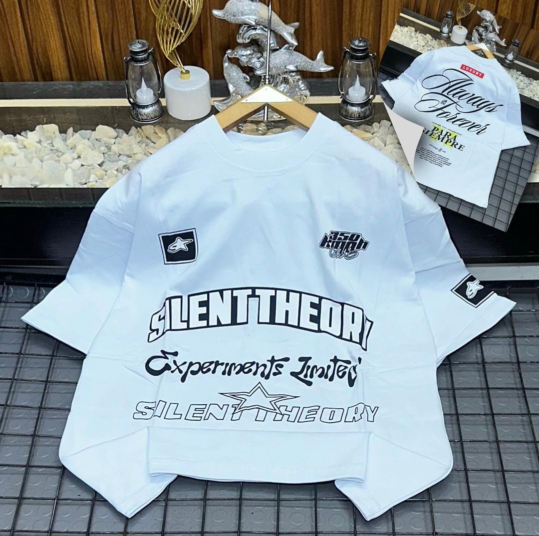 White oversized polo with Silent Theory text and star graphics on front and sleeves.