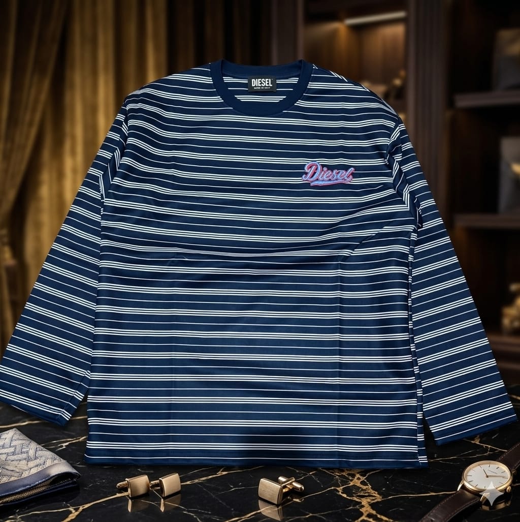 Navy blue and white striped long-sleeve top with Diesel script embroidery on chest.