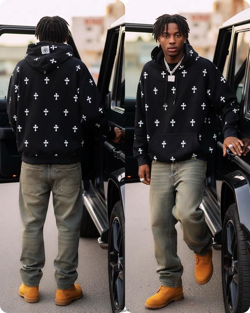 Black all-over cross print hoodie modeled from back and front angles.