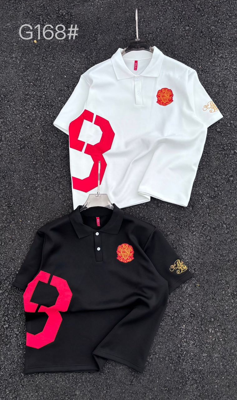 White and black polo shirts showing red number appliqué and embroidered details.