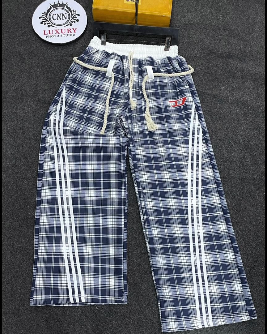 Navy plaid joggers with white side stripes, drawstring waist and elastic band.