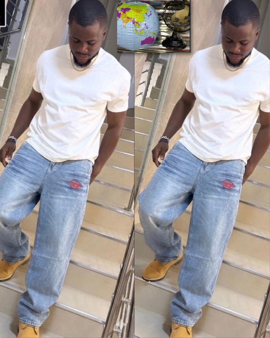 Man wearing light blue baggy jeans with red logo patch on back pocket, shown on stairs from two angles.