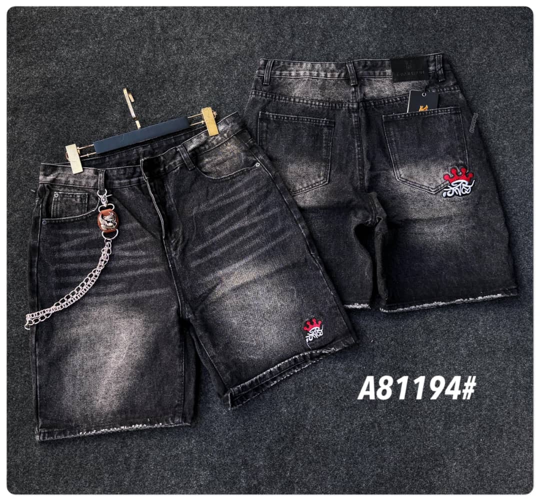 Black denim shorts with red crown patches on leg and back pocket, shown with front hanger view and flat back.