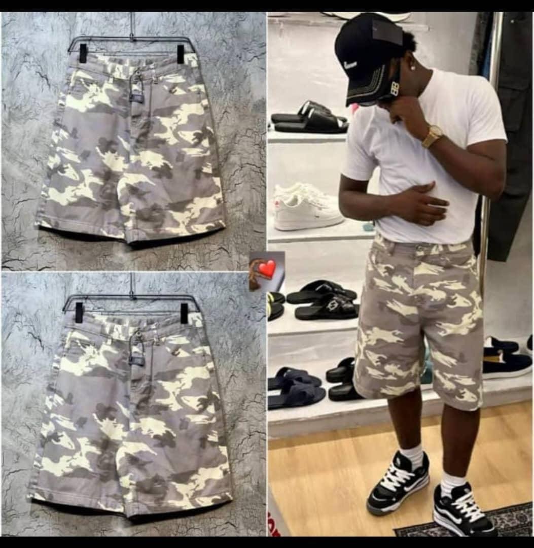 Gray camo denim shorts in flat lay views and worn by model with white tee and sneakers.