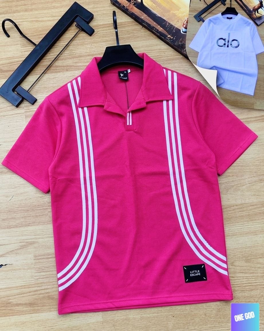 Pink striped polo shirt on wooden floor with hanger.