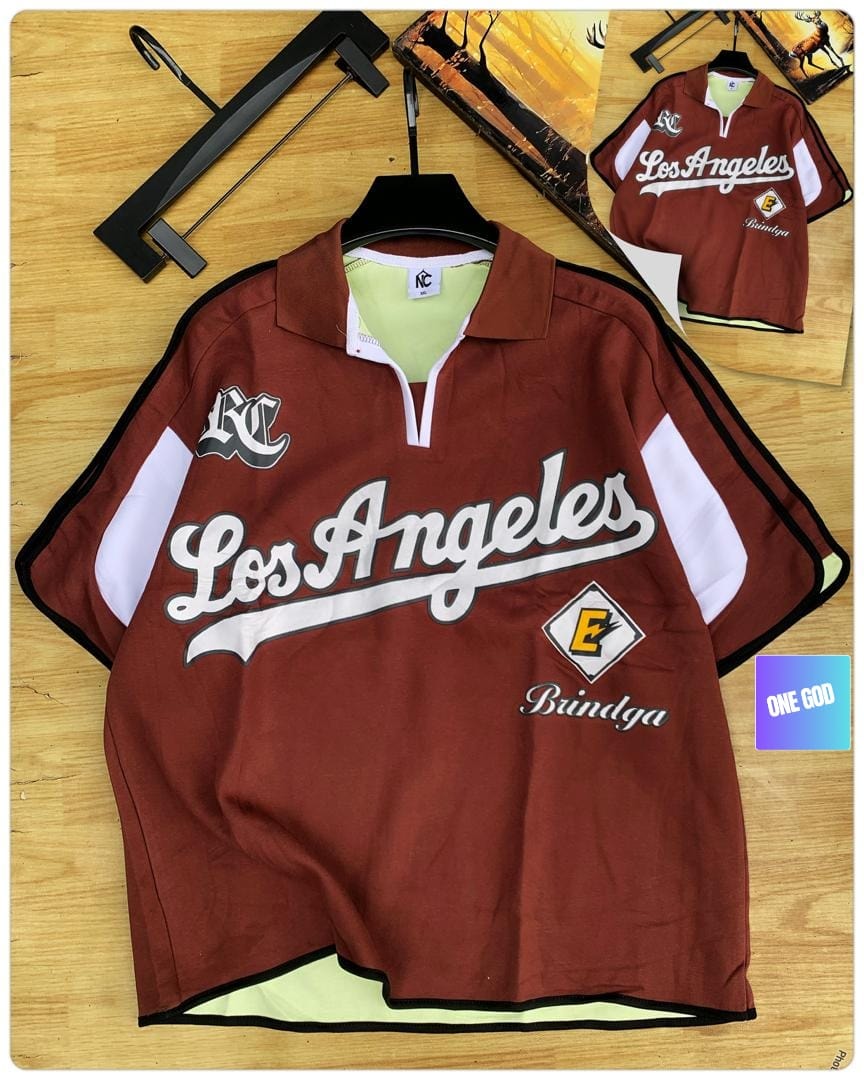 Brown Los Angeles Bindga quarter-zip polo shirt on wooden surface.
