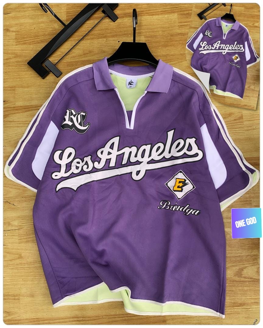 Purple Los Angeles Bindga quarter-zip polo shirt on wooden surface.