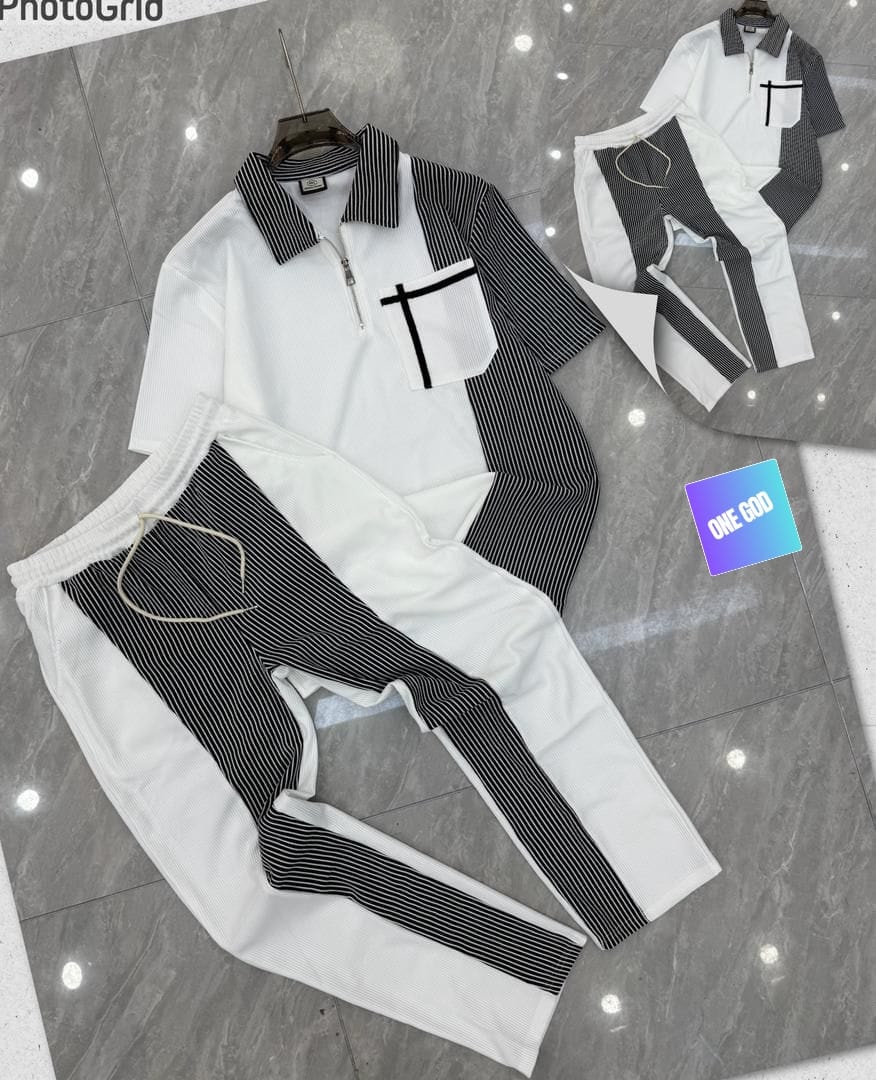 White striped panel ribbed two-piece set with black and white accents on polo top and pants.