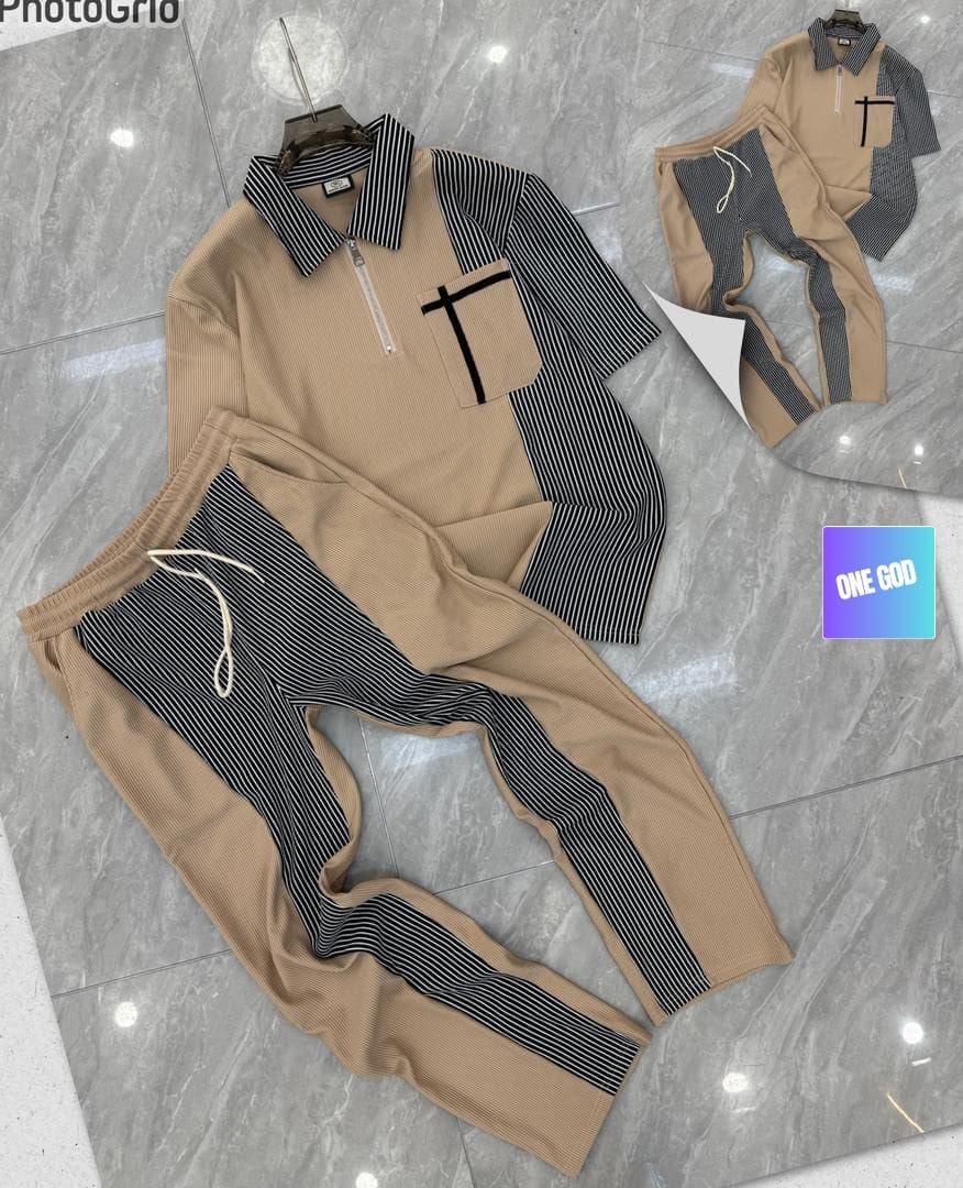 Beige striped panel ribbed two-piece set with black and white accents on polo top and pants.