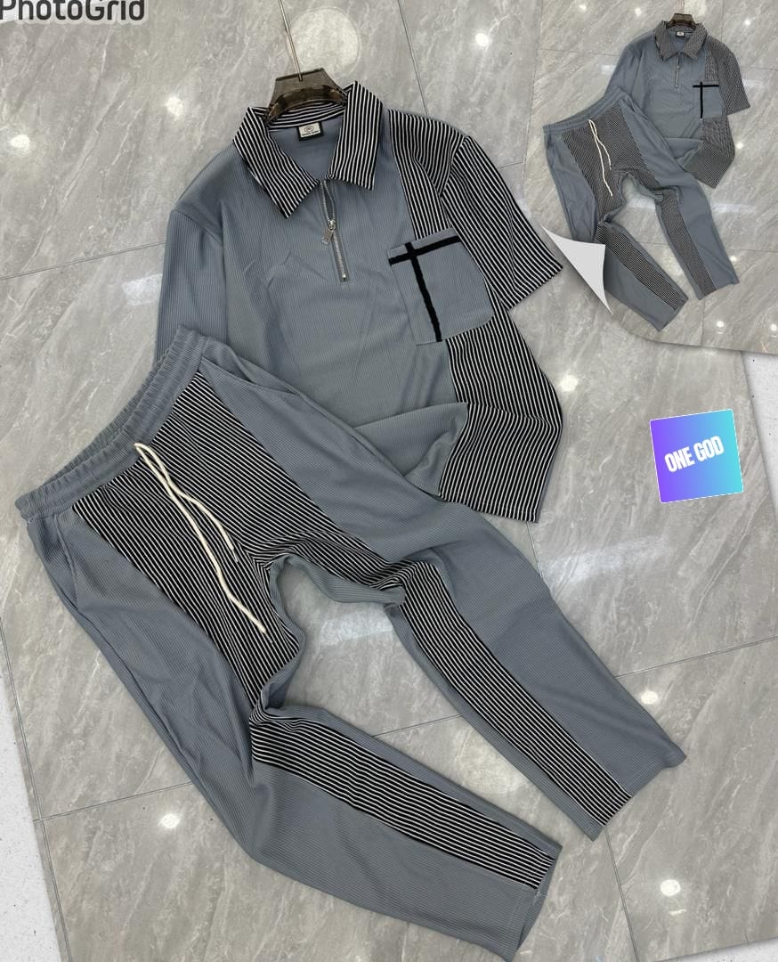 Gray striped panel ribbed two-piece set with black and white accents on polo top and pants.