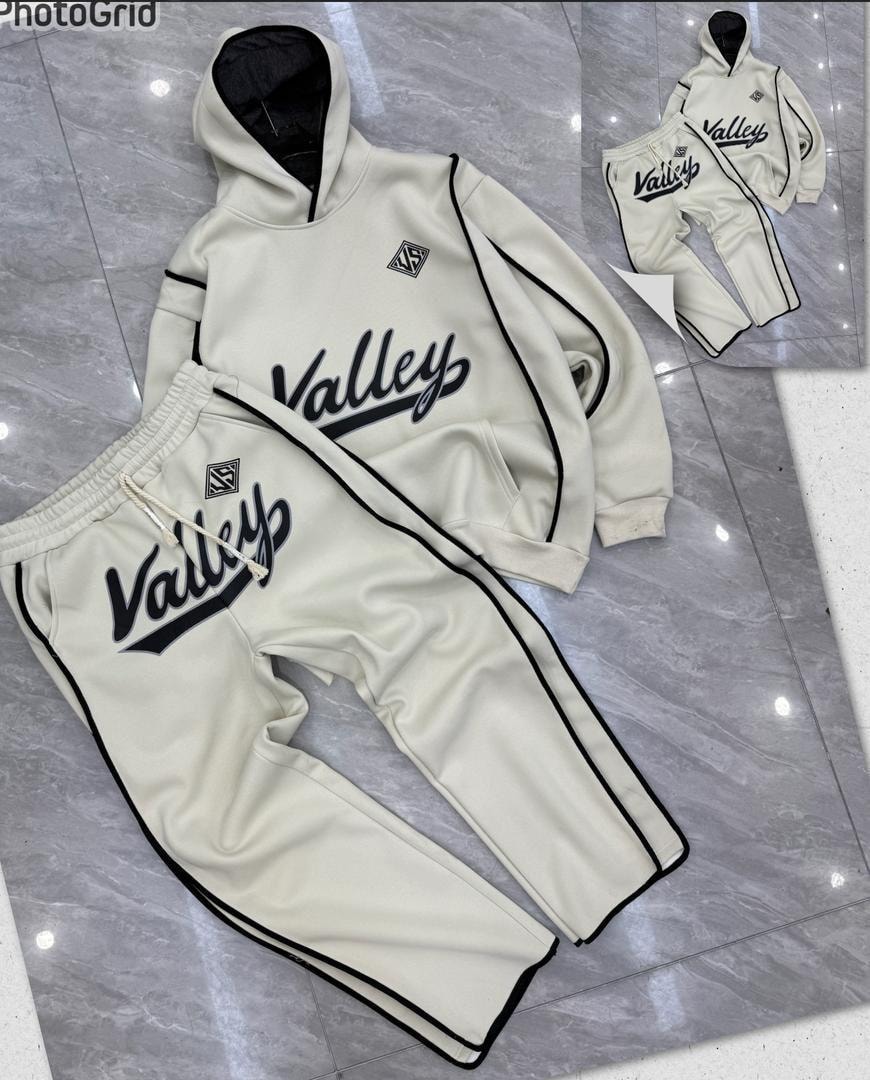 Cream Valley hooded tracksuit and joggers with black contrast piping and logos.