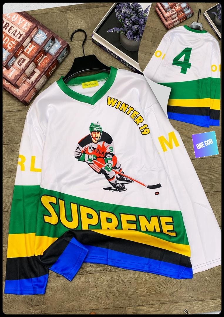 White Supreme hockey jersey with multicolored stripes, player graphic, and Winter 19 text.