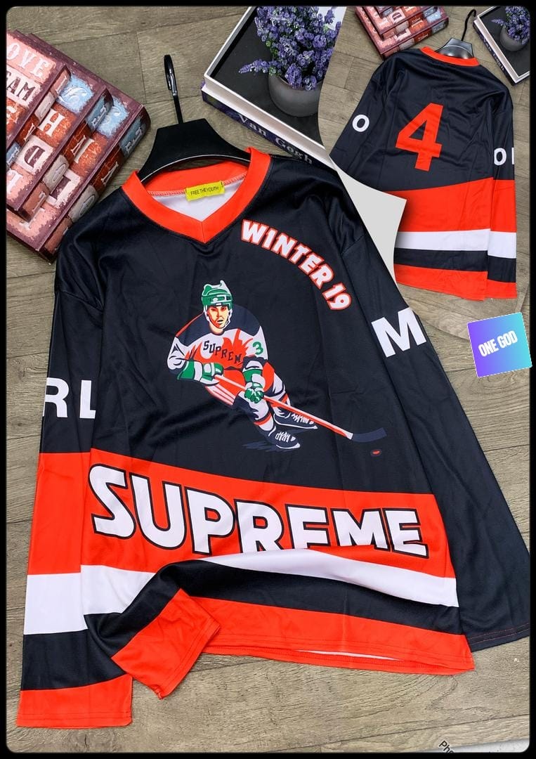 Black and red Supreme hockey jersey with player graphic, Winter 19 text, and striped accents.