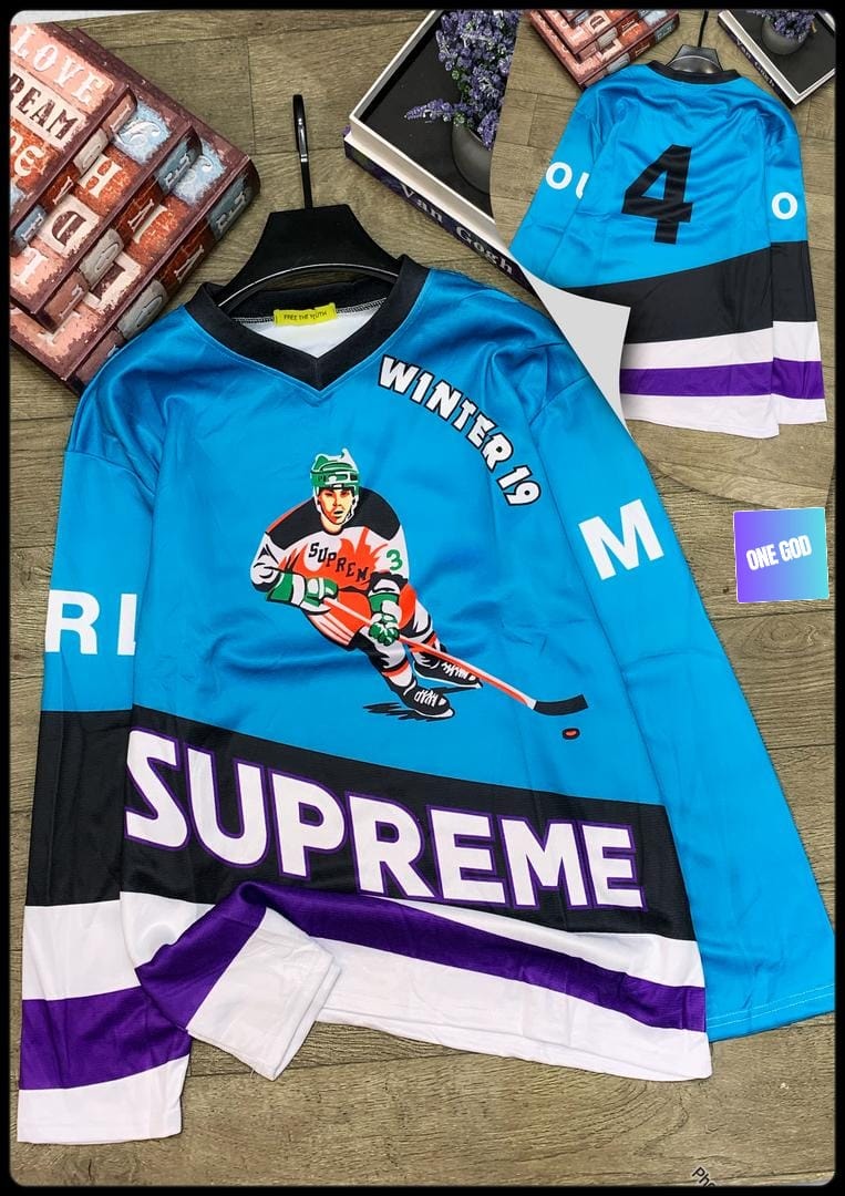 Blue Supreme hockey jersey with player graphic, Winter 19 text, and striped sleeves.