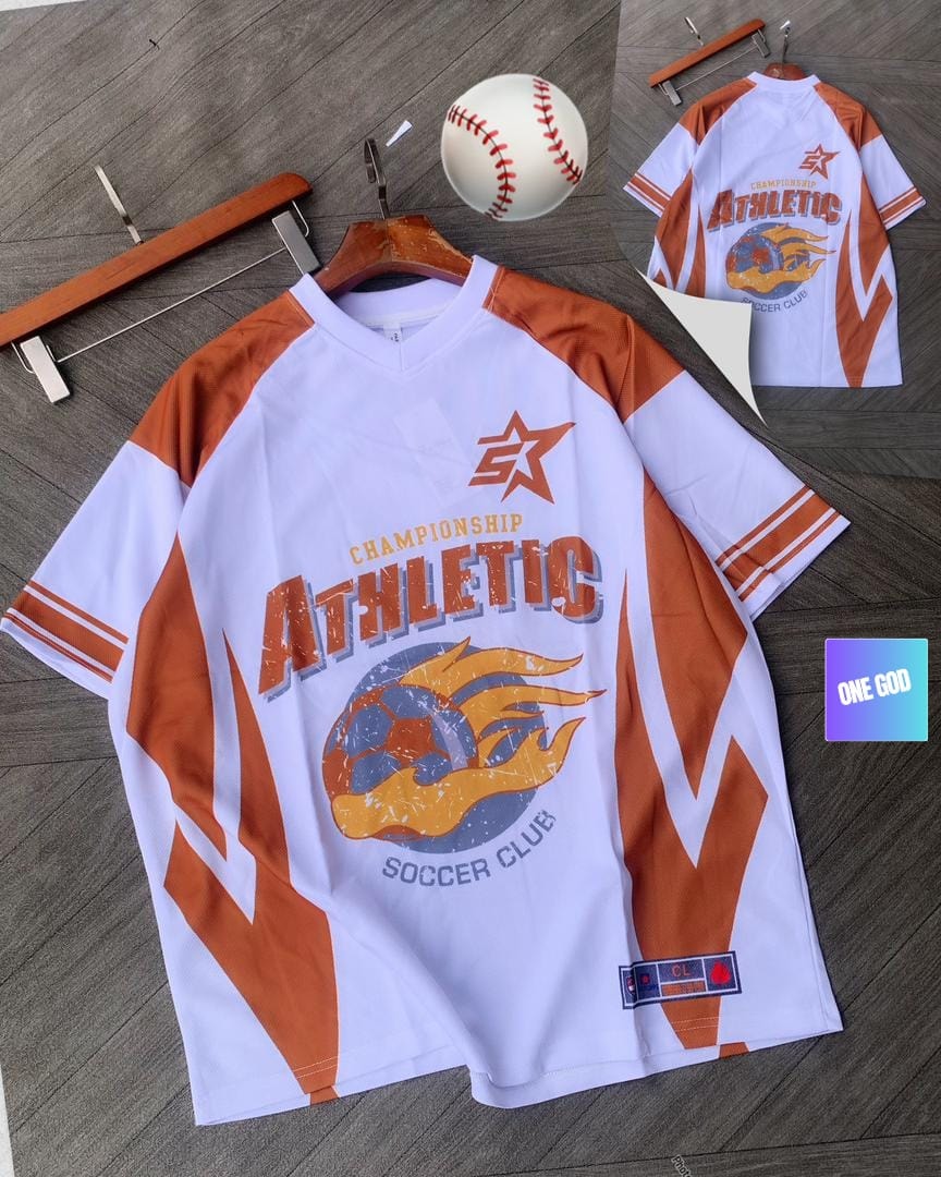 White and orange athletic soccer jersey with flaming soccer ball graphic and back view inset.
