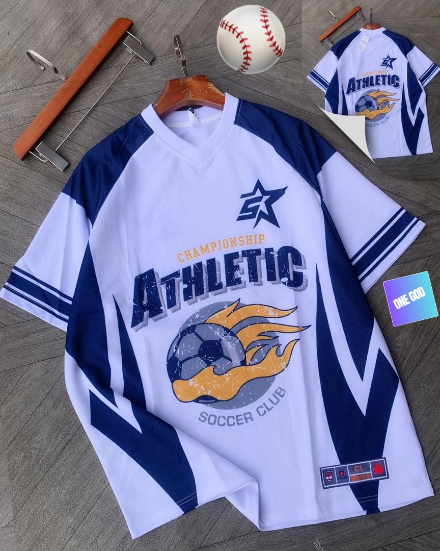 White and blue athletic soccer jersey with flaming ball graphic, baseball prop and back view.
