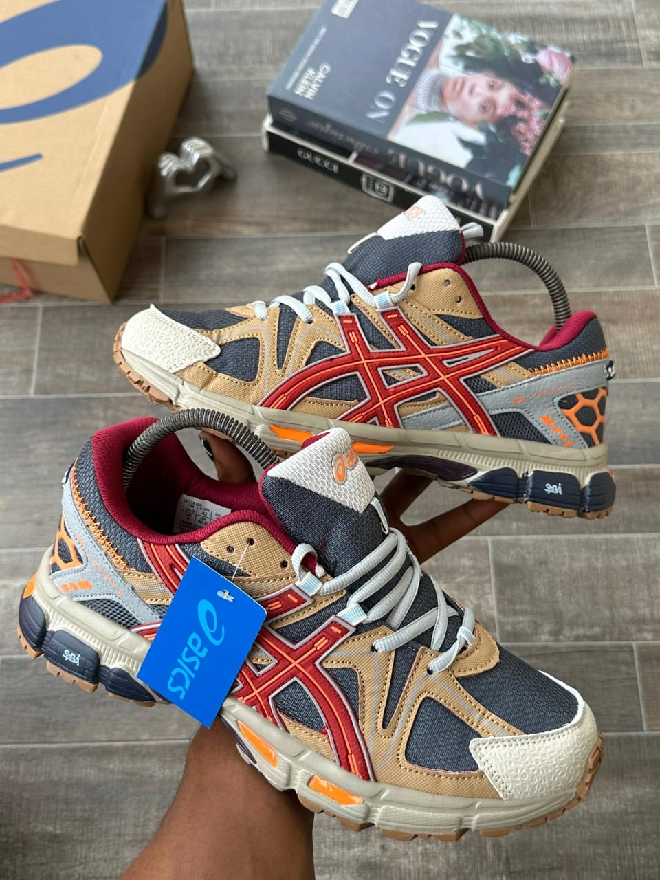 ASICS Gel sneakers in red navy and beige displayed from multiple angles with box.