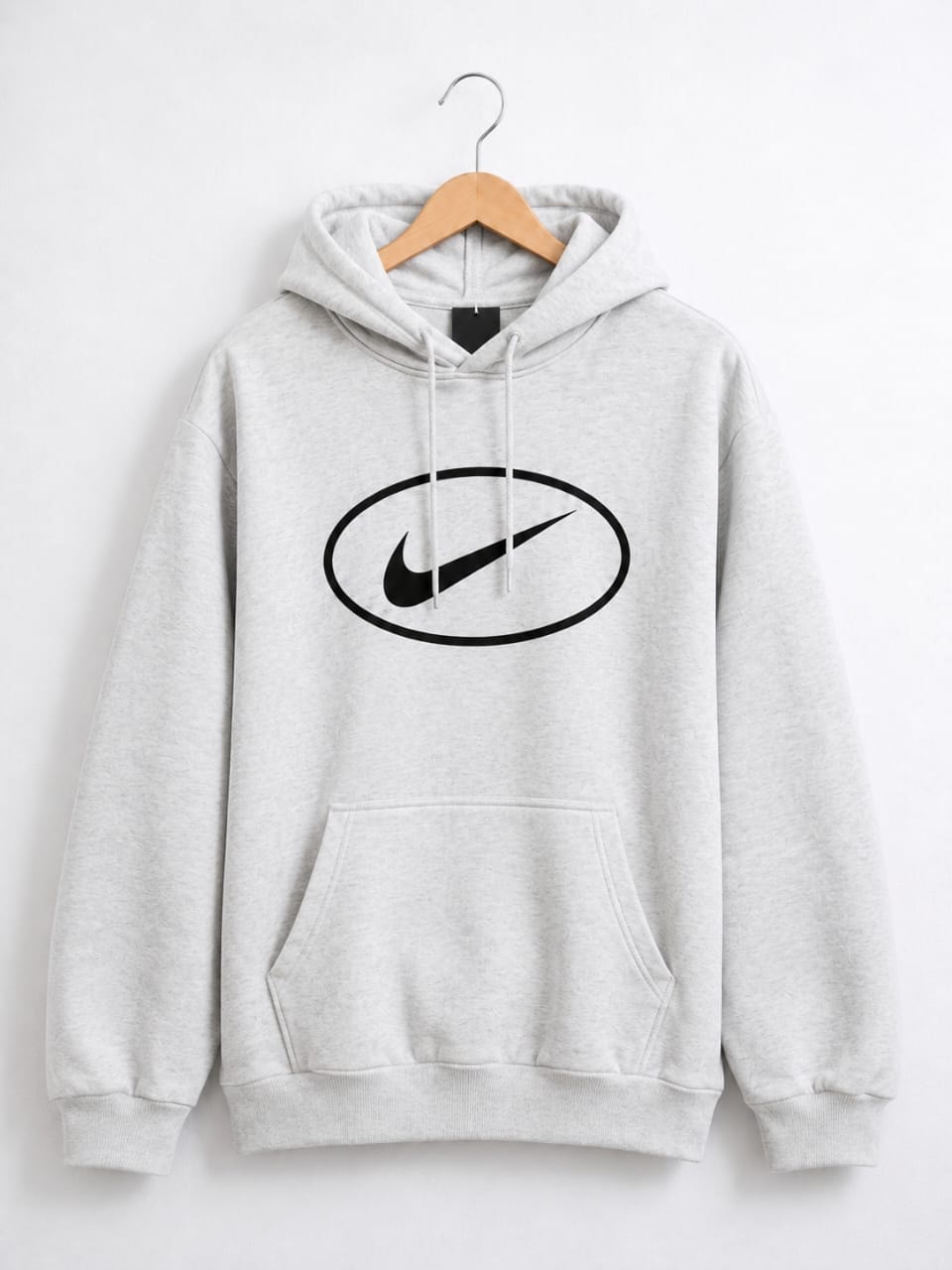 Gray pullover hoodie with large black oval Nike swoosh logo on chest.