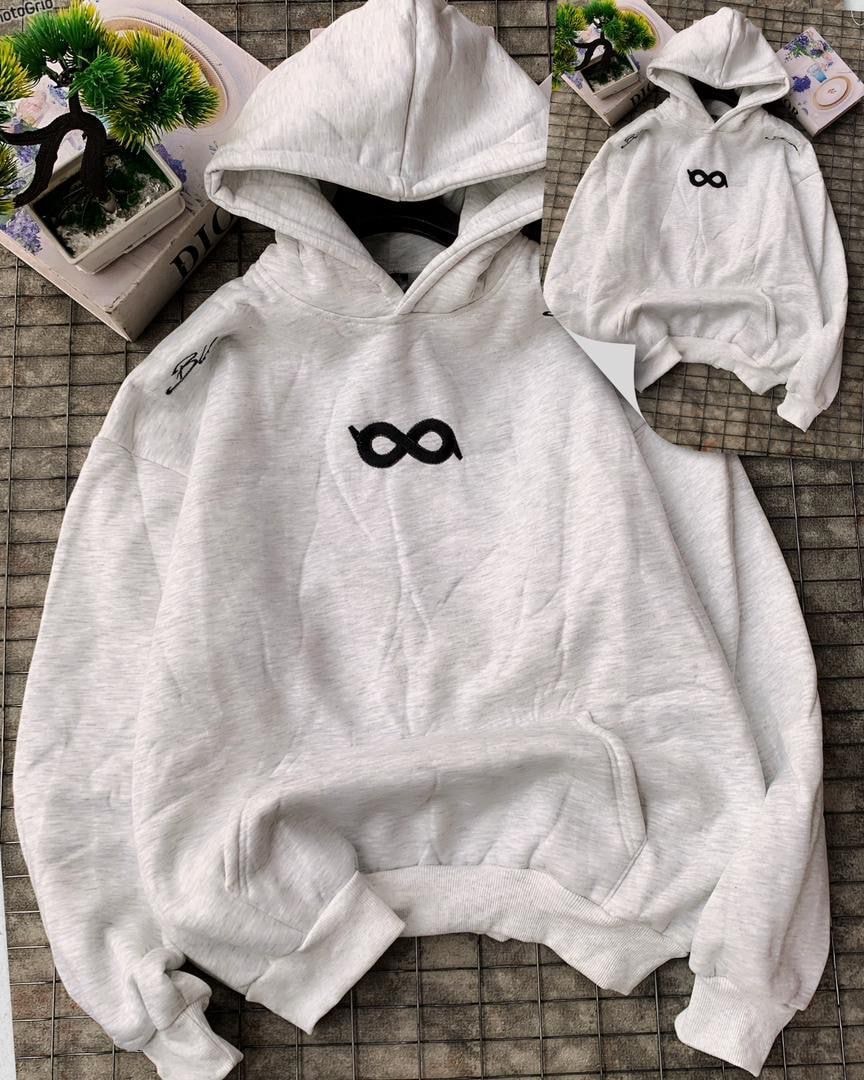 White hoodie with black infinity symbol on chest.
