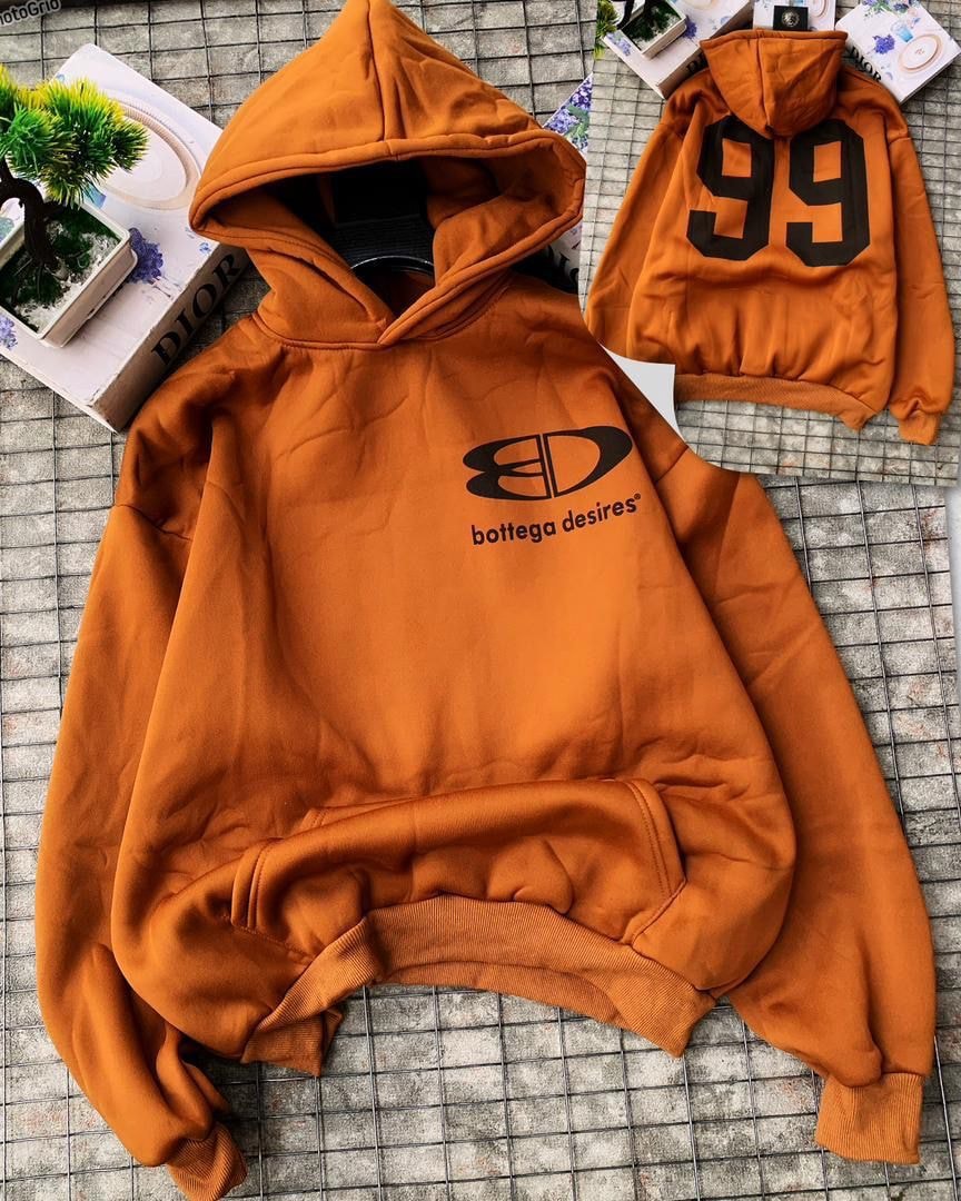 Orange hoodie with Bottega Desires logo on front and 99 on back.