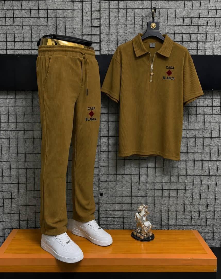 Olive Casa Blanca two-piece polo and jogger set on display stand.