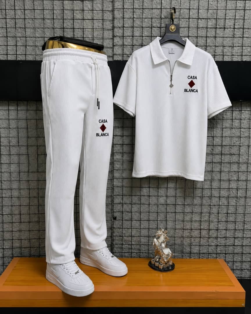 White Casa Blanca two-piece polo and jogger set on display stand.
