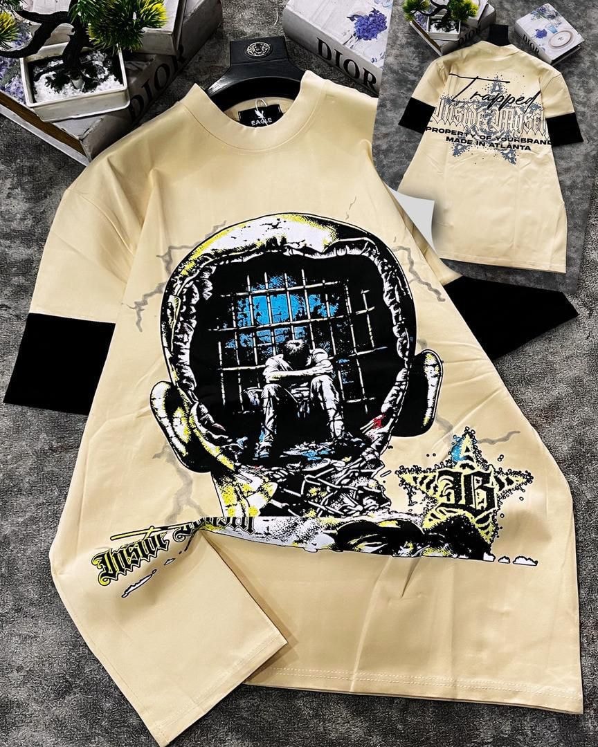 Cream round neck t-shirt with trapped head prison graphic and back print.