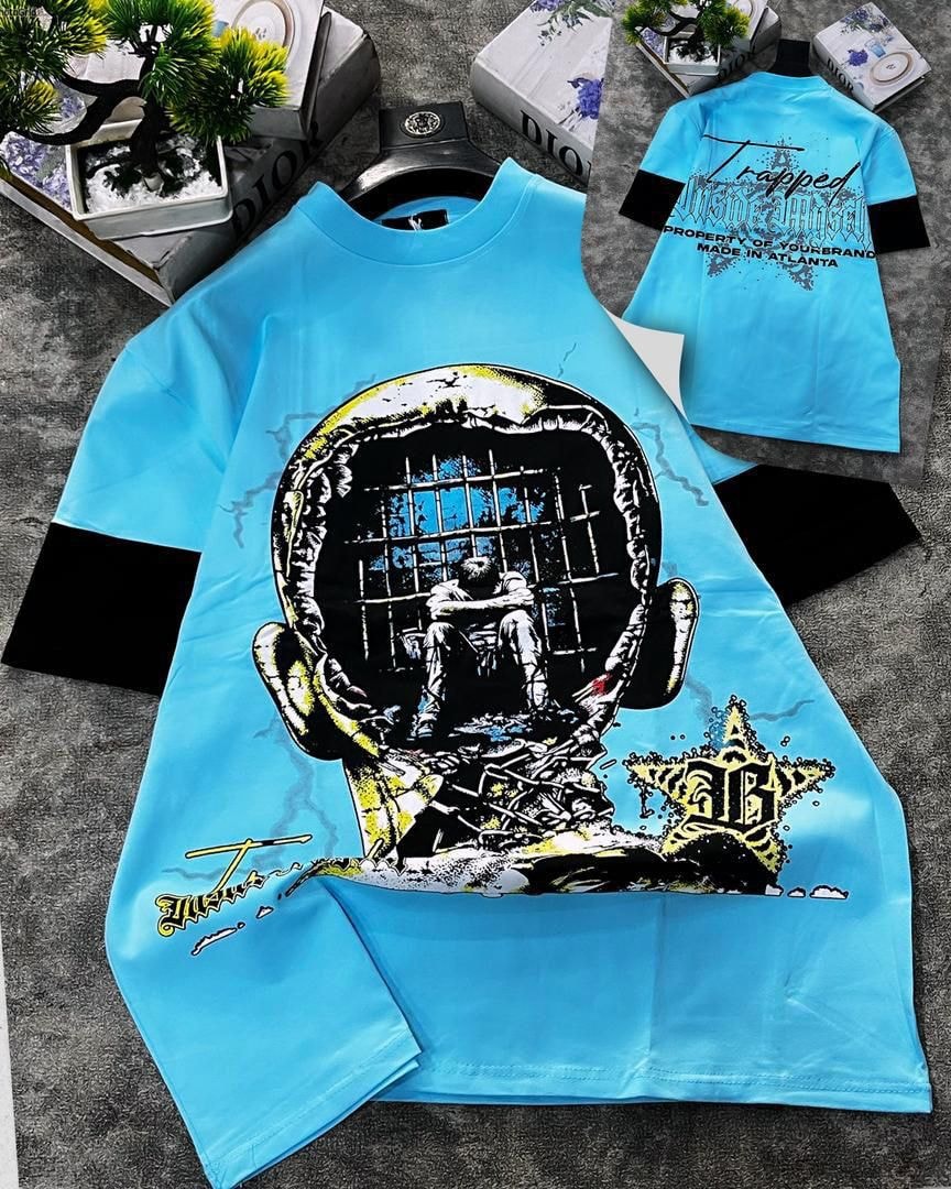 Light blue round neck t-shirt with trapped head prison graphic and back print.