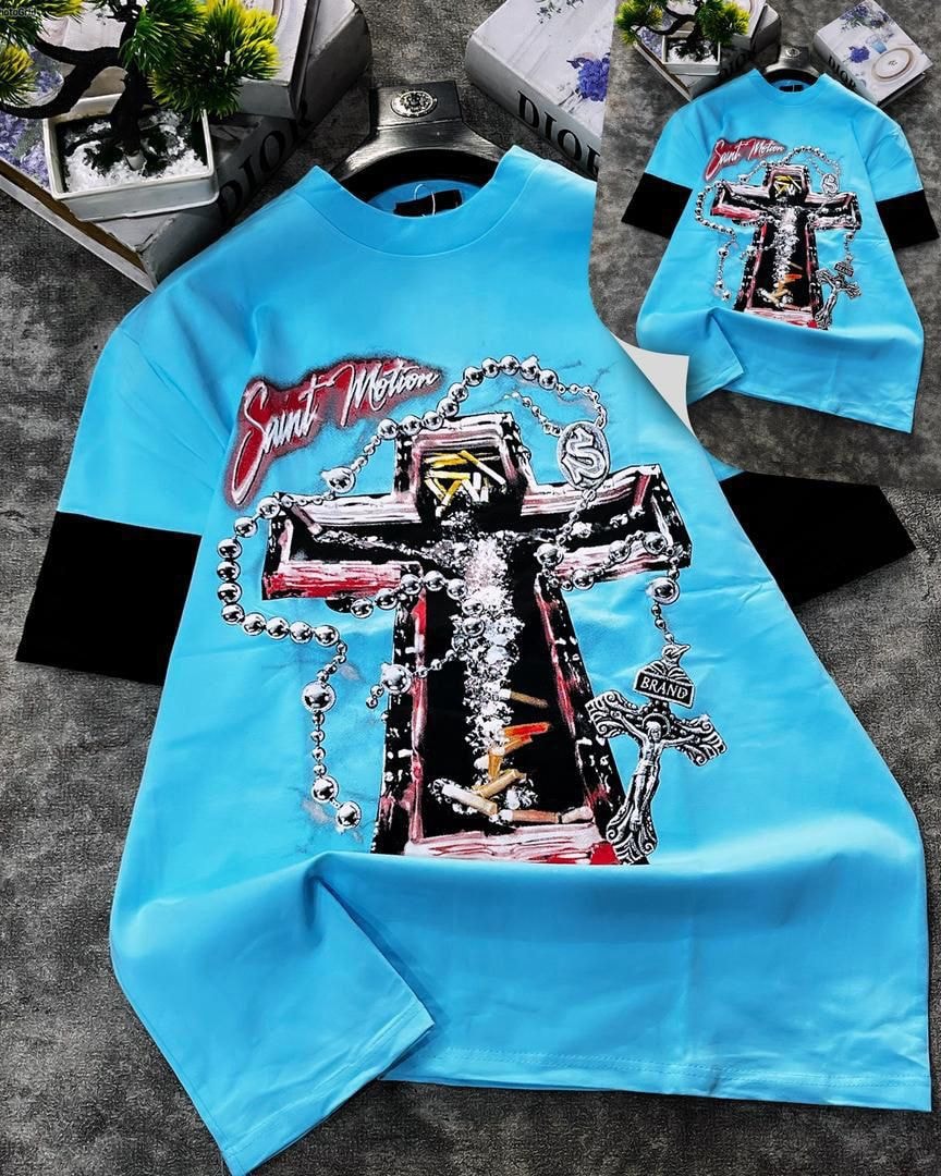 Light blue round neck t-shirt with large cross and chain graphic print.