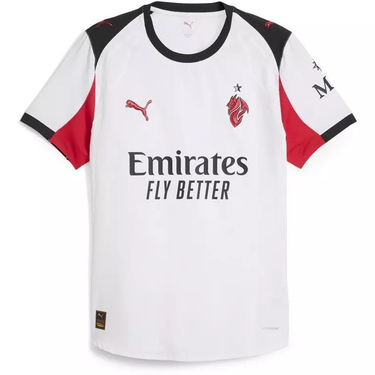 White Puma AC Milan jersey with red and black accents and sponsor text.