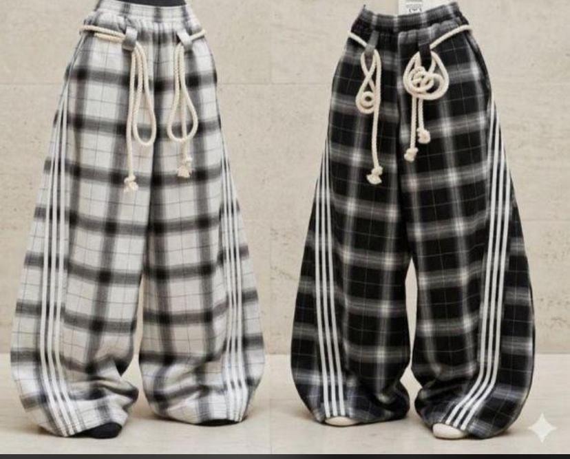 White and black plaid joggers shown side by side with drawstrings and stripes.