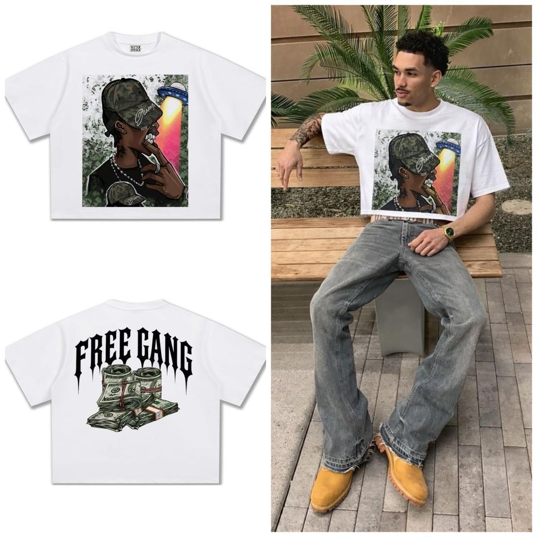 White t-shirt with front graphic print of figure and UFO, FREE GANG money back print, and model wearing it.
