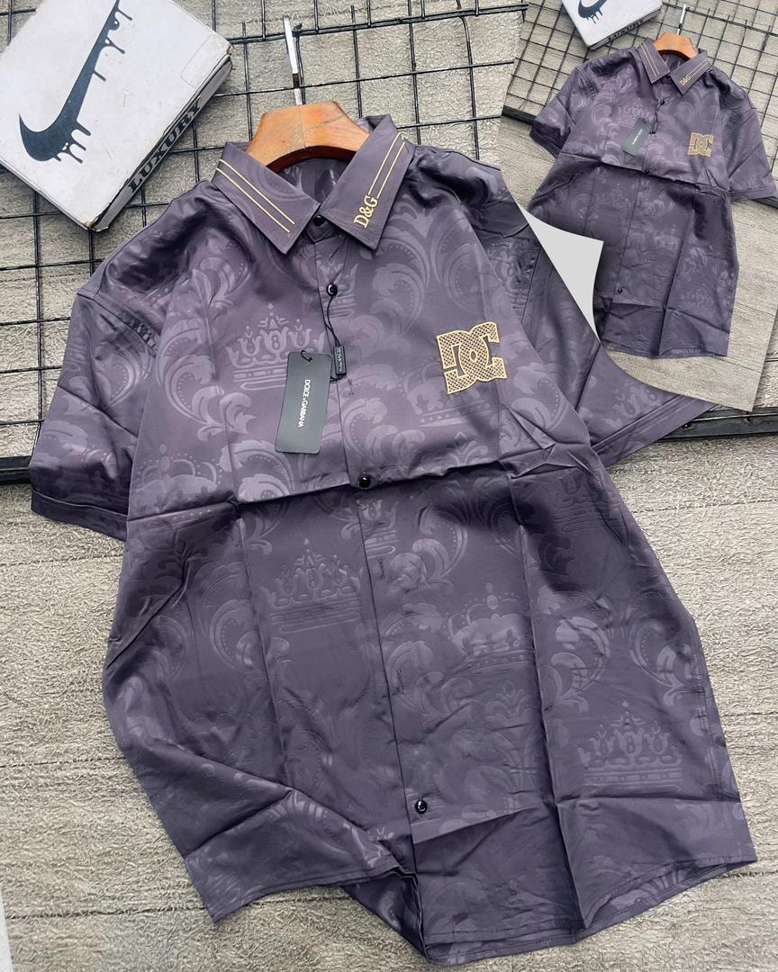 Purple D&G patterned short sleeve shirt with gold logos on collar and chest.