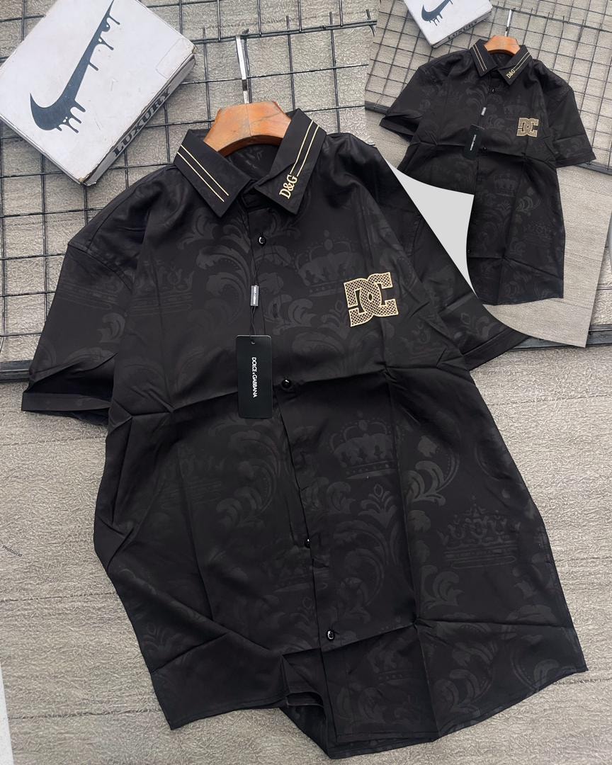 Black D&G patterned short sleeve shirt with gold logos on collar and chest.