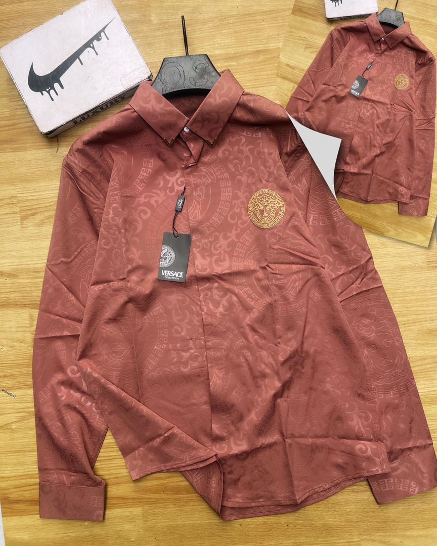 Burgundy Versace all-over print long sleeve shirt on display with branding.