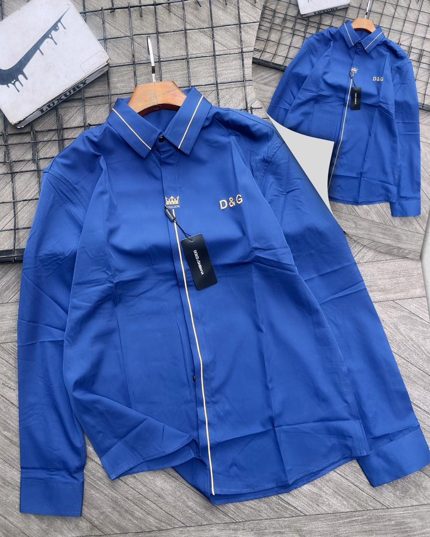 Blue D&G embroidered long sleeve shirt with gold piping and crown logo.