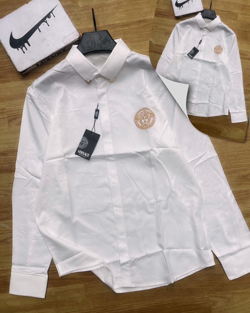 White luxury corporate shirt with Versace tag and Medusa logo on chest.