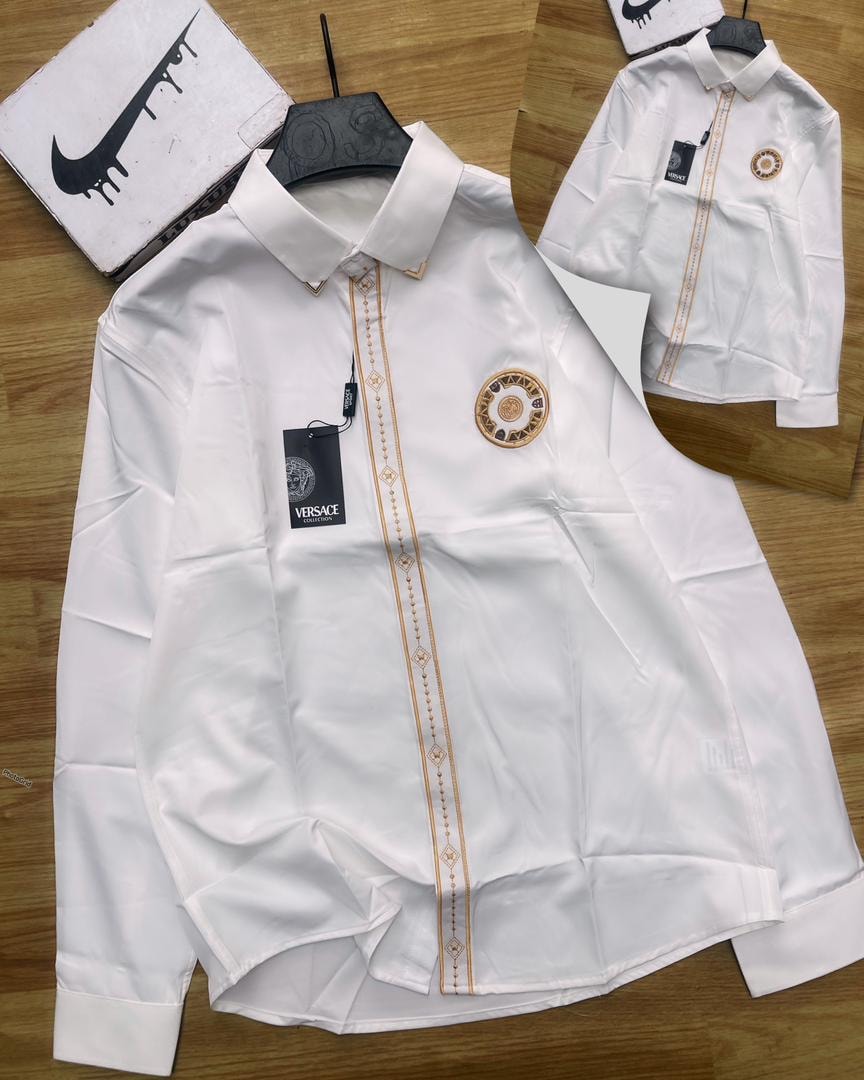 White luxury corporate shirt with gold trim, Versace tag and circular chest logo.