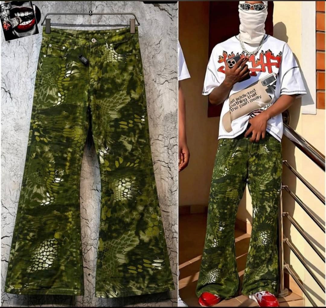 Baggy jeans with olive green snake scale print displayed flat and on model.
