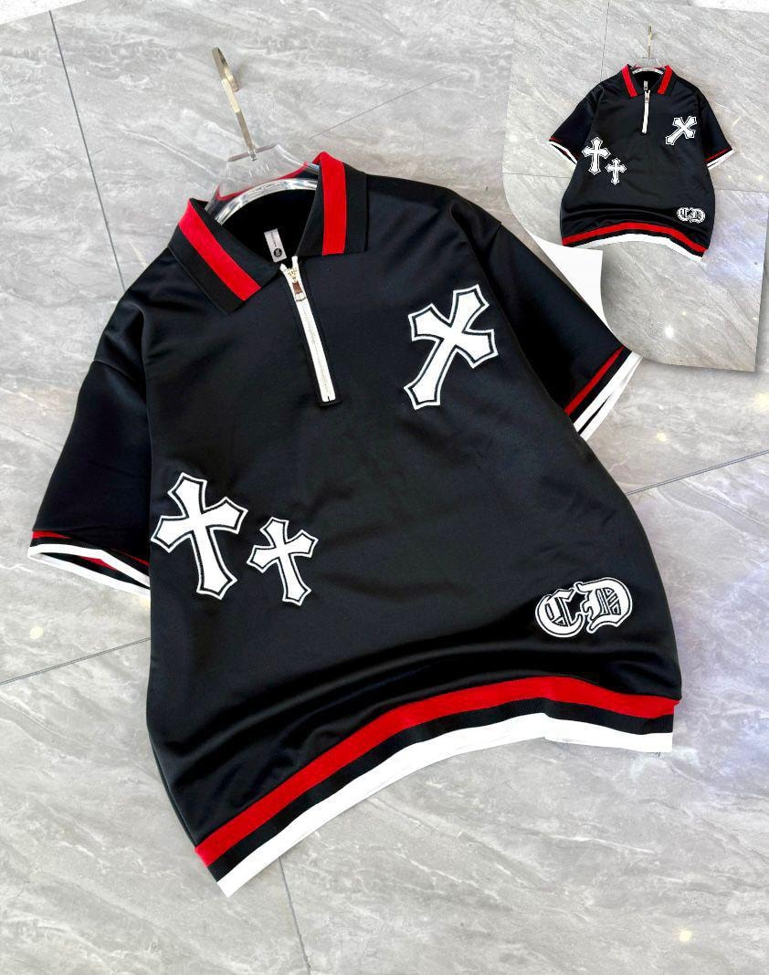 Black quarter-zip polo shirt with white cross embroidery and striped trim.