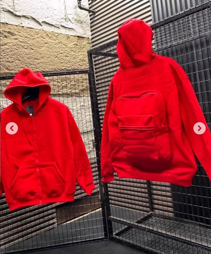 Front and back views of red zip-up hoodie with front pocket and large quilted back pouch.