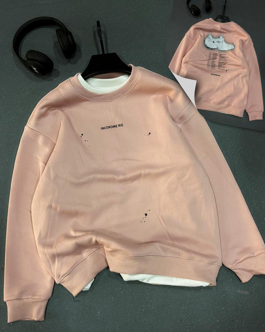 Pink oversized sweatshirt with INCEROME RIE text and ink splatter on front, back view inset.