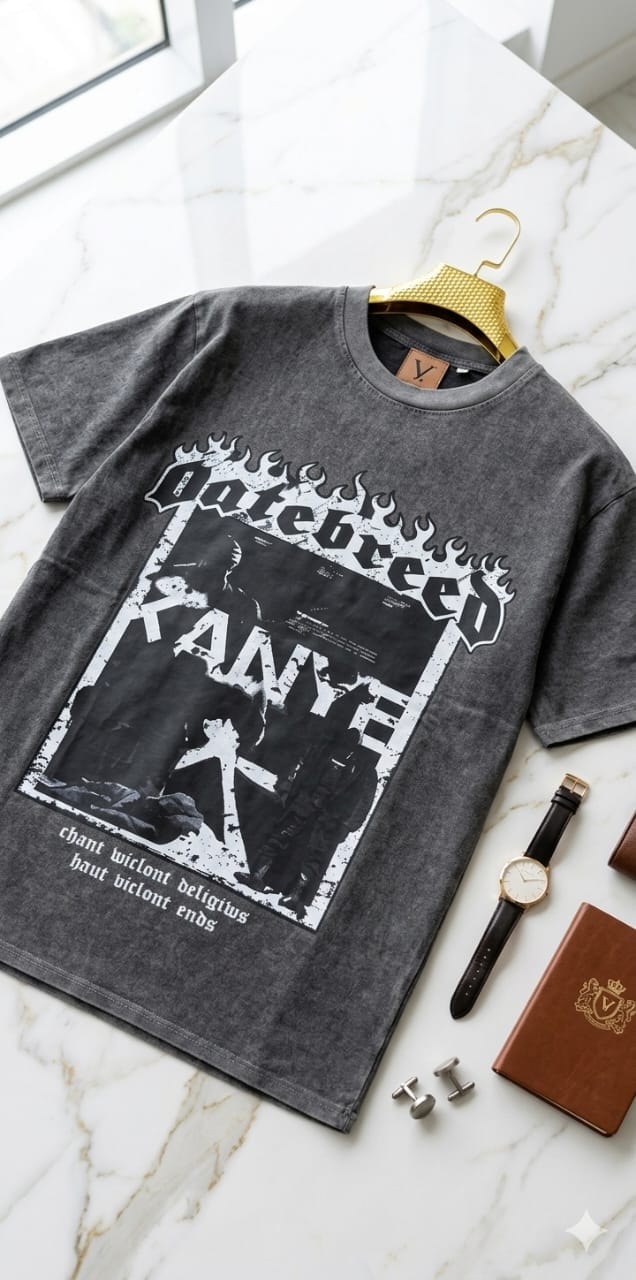 Stonewashed gray t-shirt with hatebreed KANYE graphic, flames and cross imagery on marble with watch and accessories.