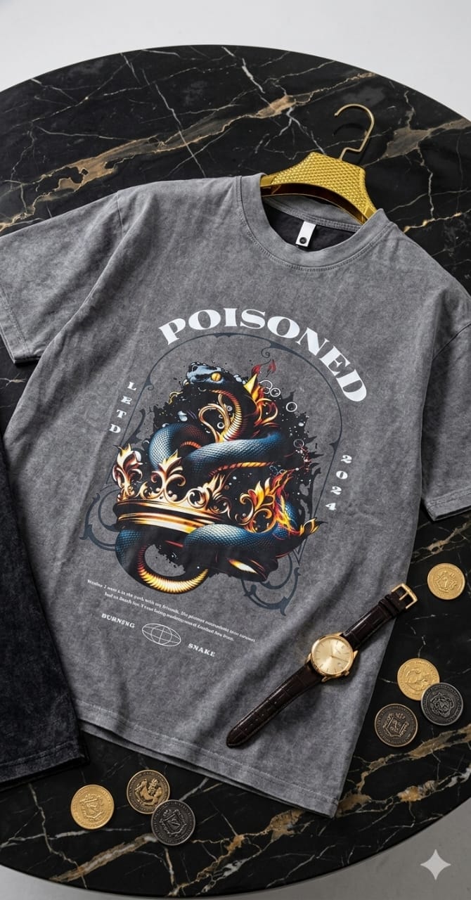Stonewashed gray t-shirt with poisoned snake crown graphic, POISONED text and 2024 details on marble surface with watch and coins.