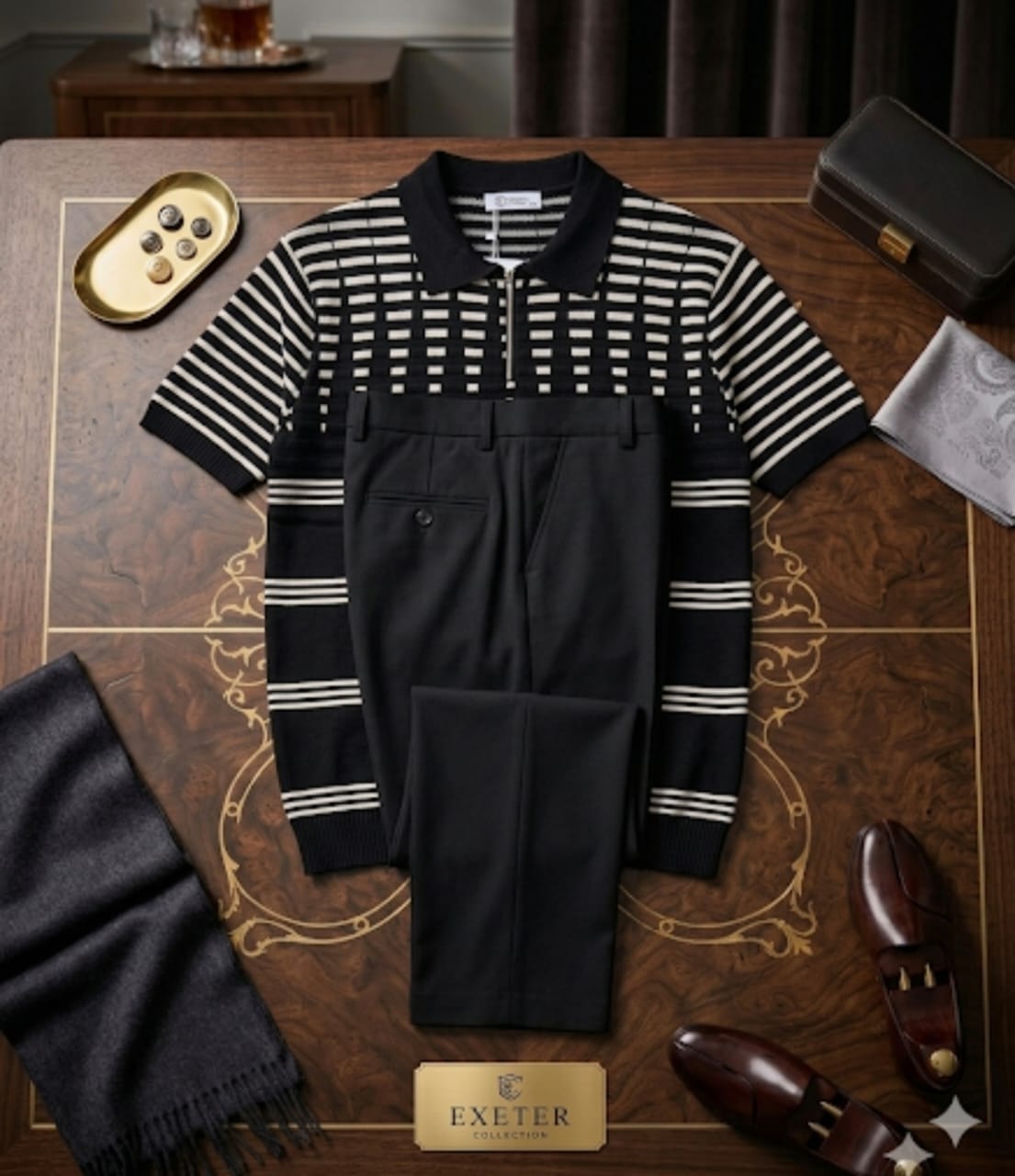 Black and white striped knit polo shirt paired with black trousers in elegant flat lay with shoes and scarf.