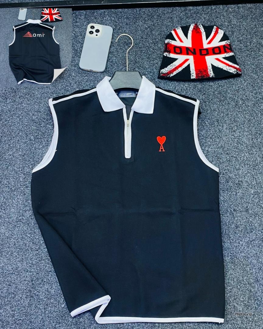 Black armless quarter-zip polo with red heart A logo.