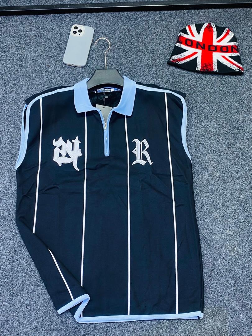 Black armless polo with white pinstripes and 24 R embroidery.