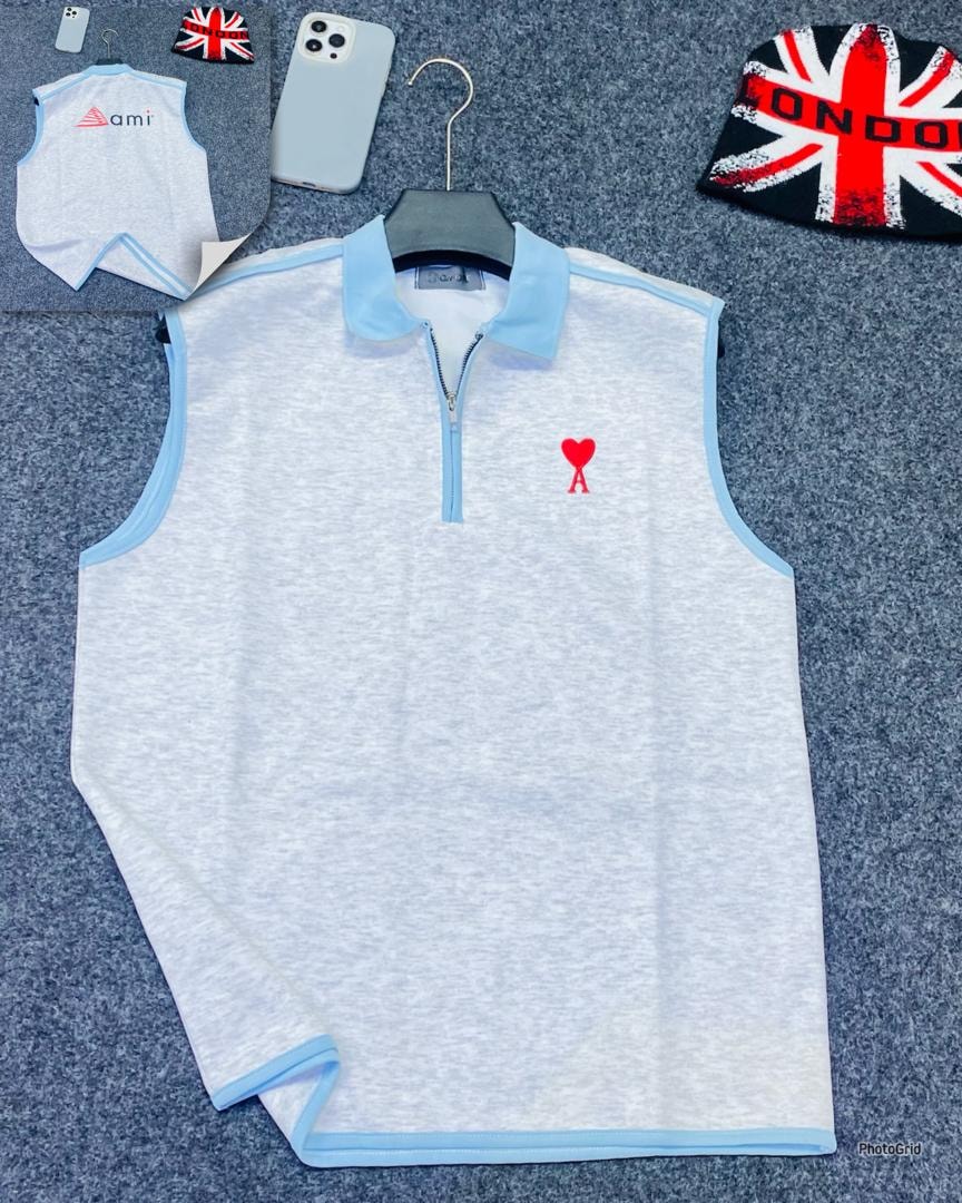 Light gray armless quarter-zip polo with red heart A logo.